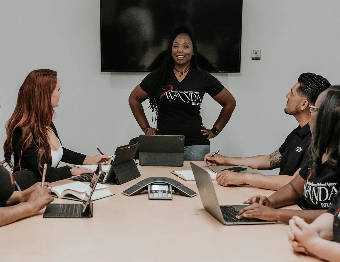 Hands together in a circle, symbolizing community support.